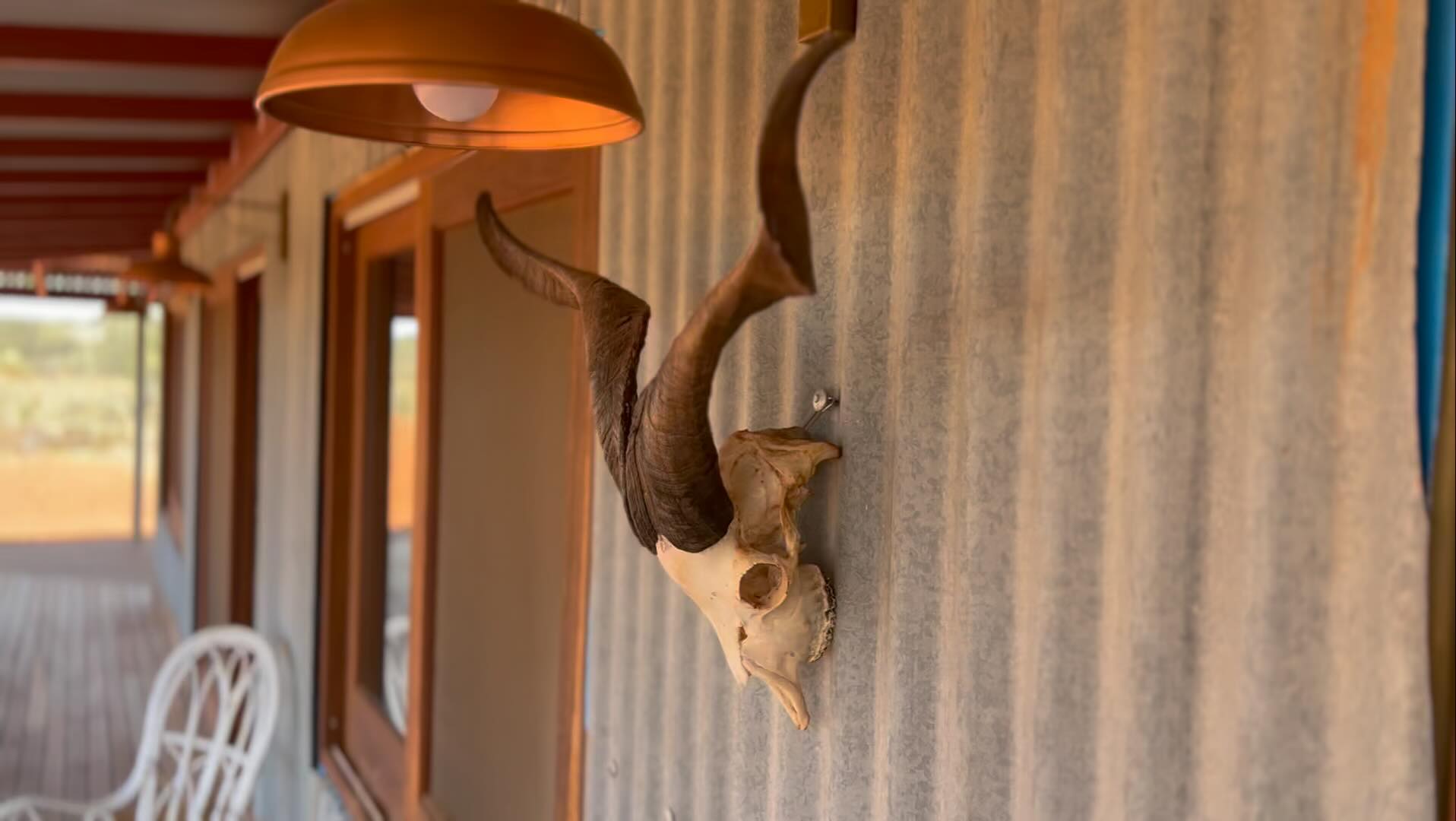 Finished patio with ram's skull on the wall.