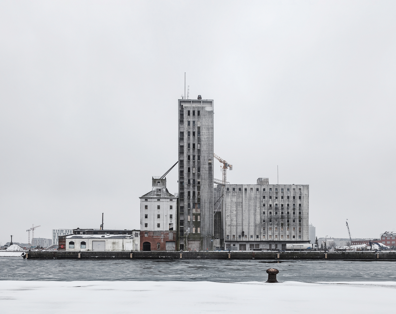 Old brutalist grain Silo in Copenhagen before it was restored, looking very bleak.