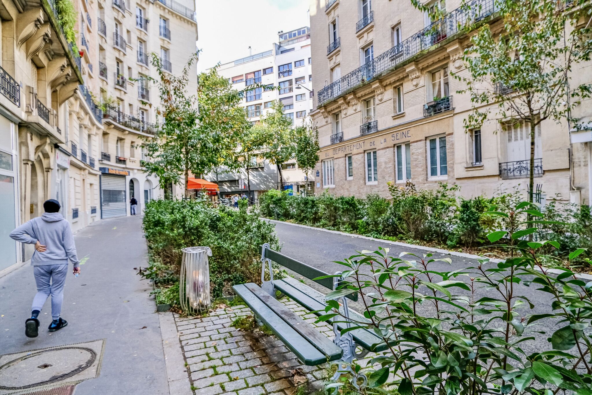 Wonderful photos of Paris Streets filled with greenery. Trees and shrubs and flowers in places where cars were once parked.