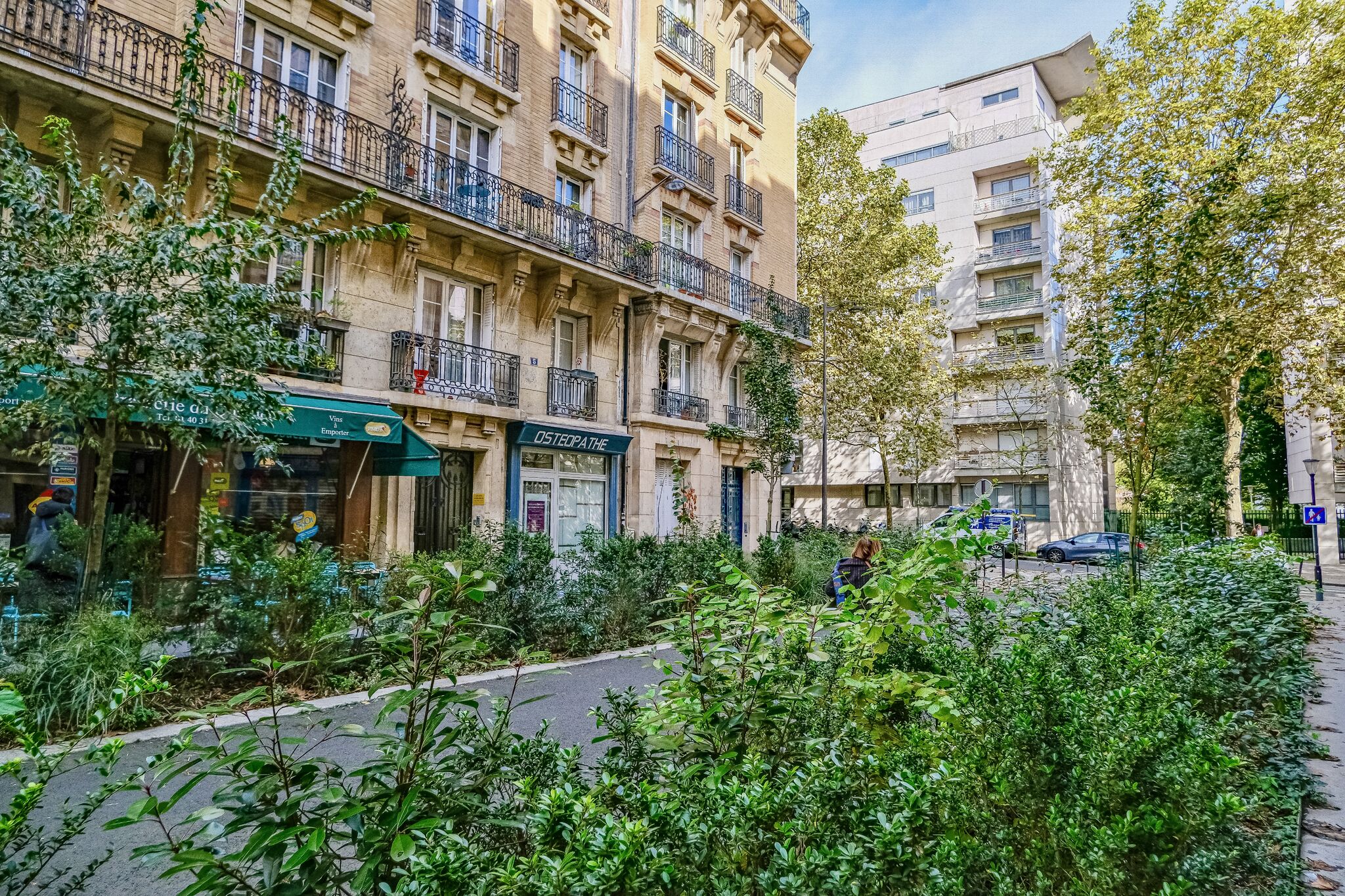 Wonderful photos of Paris Streets filled with greenery. Trees and shrubs and flowers in places where cars were once parked.