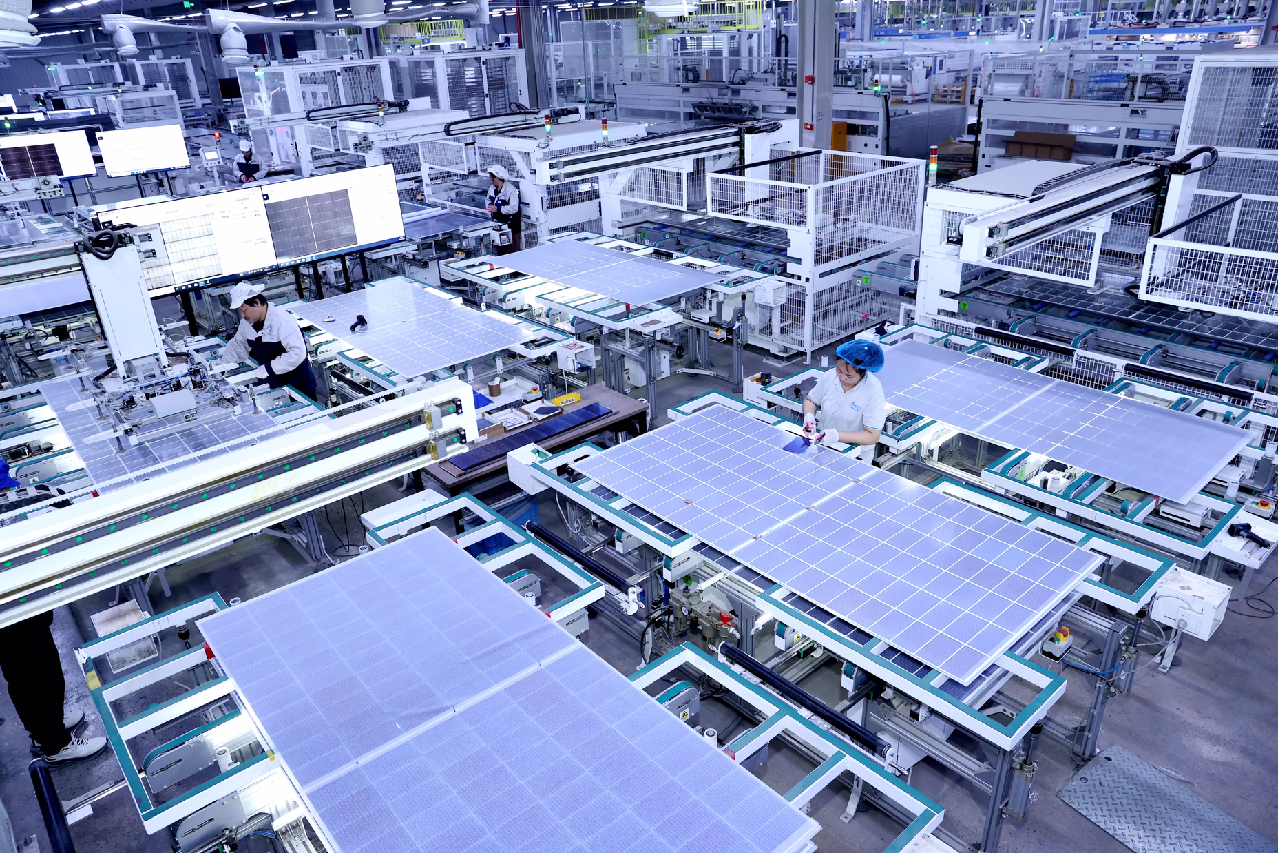 Employees work on solar panels on a production line at a workshop in Suqian, Jiangsu province, China, on March 22, 2025. Images via: Wang Li / VCG / Getty